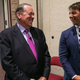 Huckabee (left) cracks himself up again (Photo: Congressional Quarterly/Getty Images)